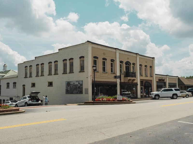 Two-story brick commercial building on a downtown corner in a small Georgia town