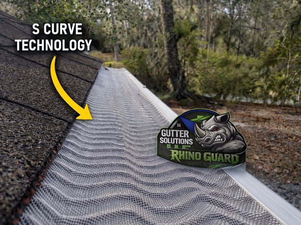 Rhino Guard micro-mesh leaf guard installed along the edge of a shingled roof